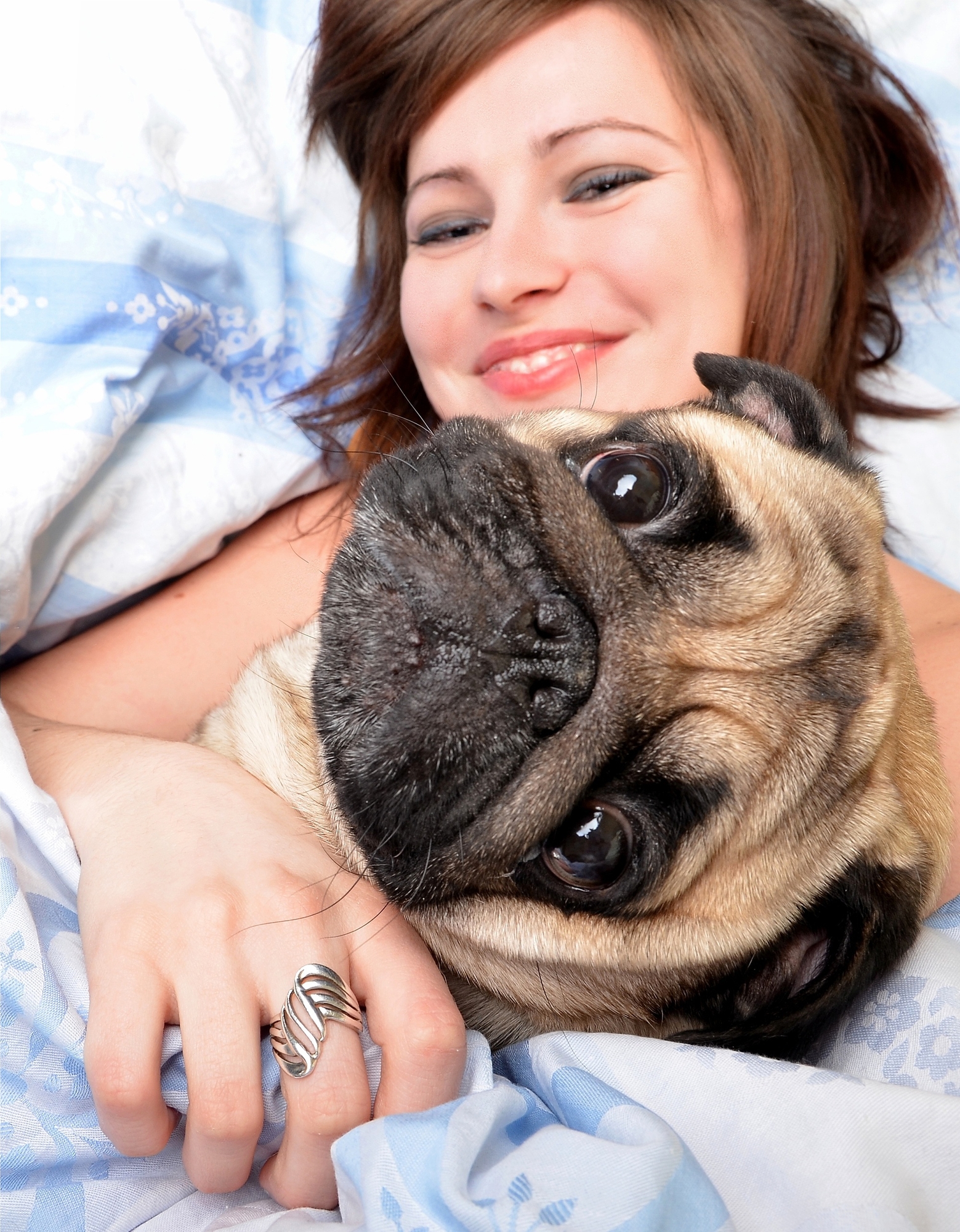 Owner-sleeping-with-pug-dog